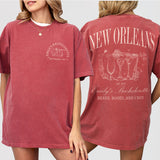 Crimson cotton bachelorette shirt with New Orleans and Mardi Gras themed designs, perfect for a girls trip or bride celebrating in NOLA