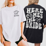 Matching retro disco bachelorette shirts featuring "Here Comes The Bride" design - perfect bridesmaid gifts for a fun bridal party celebration