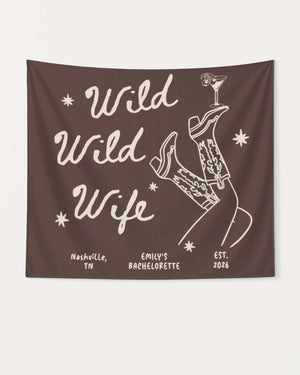 Bride and bachelorette party banner with Wild Wild Wife cowgirl and martini theme. Personalized with bride name, destination city, and weekend year for the full crew celebration.