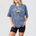 Cozy blue jean bridesmaid sweatshirt with a fun "Love is Brewing Bach Club" espresso martini design for bachelorette parties or bridal showers