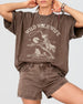Bride and bridesmaids matching bachelorette tees with vintage western rodeo art. Personalize with the bride's name, destination city, and weekend date for the whole Wild Wild Wife crew.