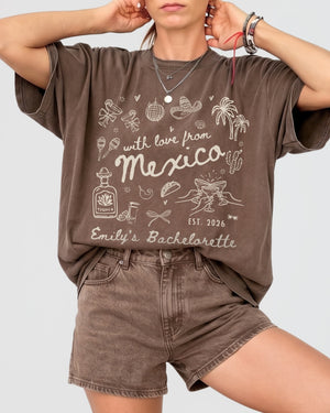 Bride and bridesmaids matching bachelorette tees with vintage botanical line-art and script lettering. Personalized with bride name, destination, and year for a Mexico girls weekend crew.