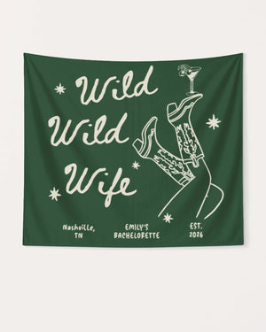 Bachelorette party banner with Wild Wild Wife cowgirl and martini line-art design. Personalized with bride name, destination city, and year for the weekend celebration.