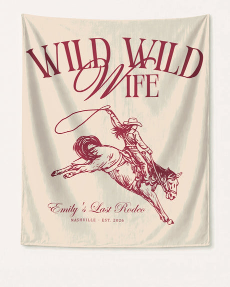 Bachelorette weekend party banner with Wild Wild Wife cowgirl theme and vintage script lettering. Personalized with bride name, destination city, and year for the last rodeo celebration.