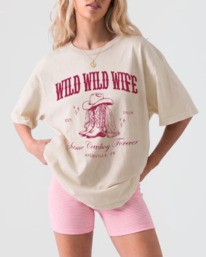 Bachelorette weekend tee for a wild west Nashville girls trip, country bride theme with vintage cowboy boot illustration and ornate western lettering. Personalized with name, year, and city.