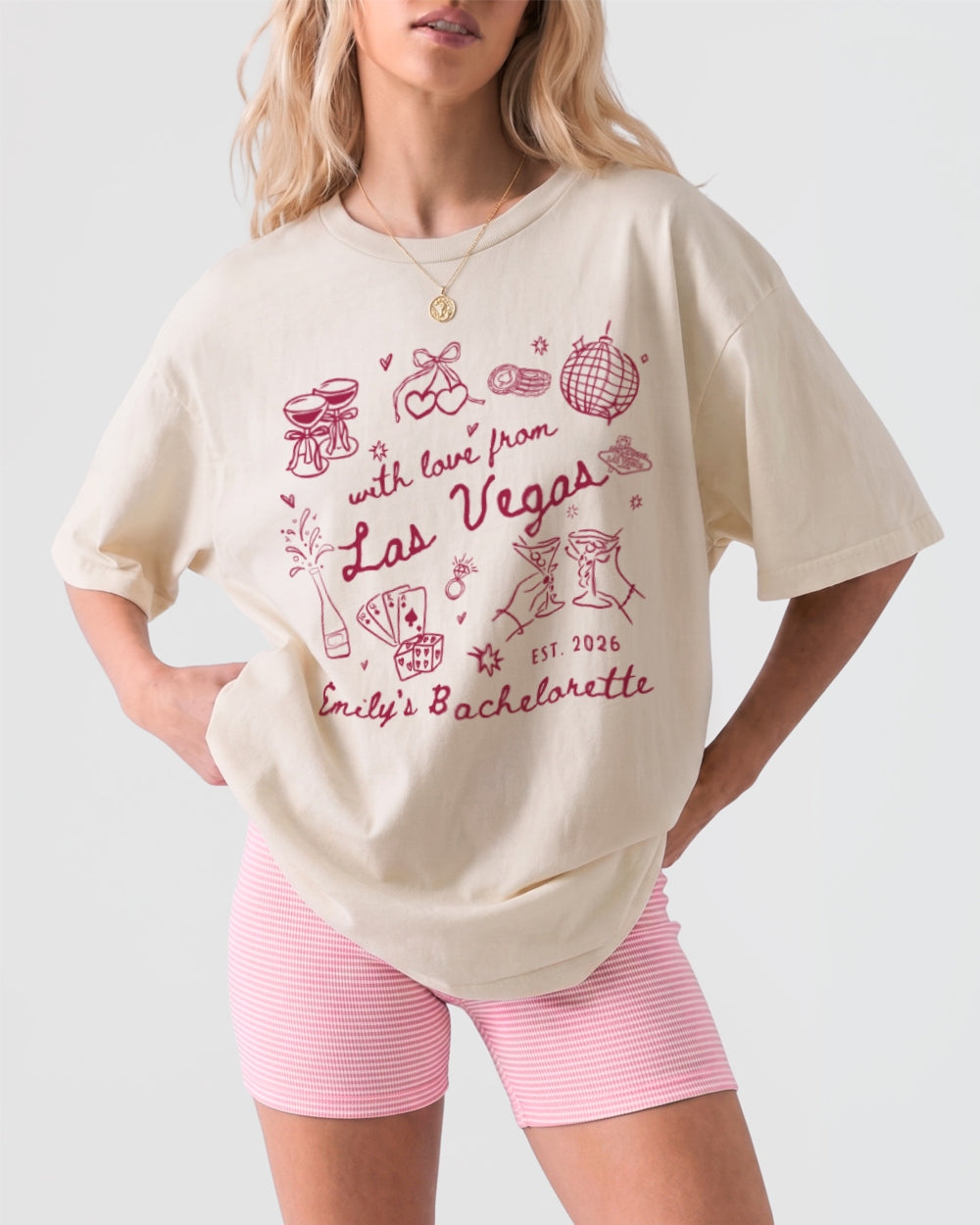 Las Vegas bachelorette weekend matching tees with playful doodle art and script lettering. Personalized with bride name, year, and destination for the whole crew.
