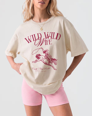 Bachelorette weekend western tee with vintage rodeo illustration and Wild Wild Wife script lettering. Saddle up for the bride's last ride, matching shirts for the whole cowgirl crew.