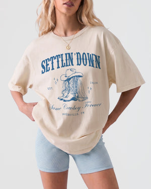 Vintage western illustration bachelorette tee with decorative cowboy boot art and Last Rodeo script. Personalized with bride name, wedding year, and destination city for the whole crew.