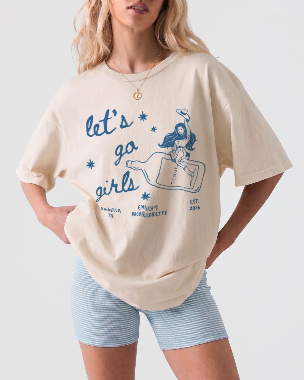 Vintage line-art cowgirl bottle tee with minimalist illustration style, perfect for girls night out. Casual Let's Go Girls graphic shirt for the crew hitting the town.