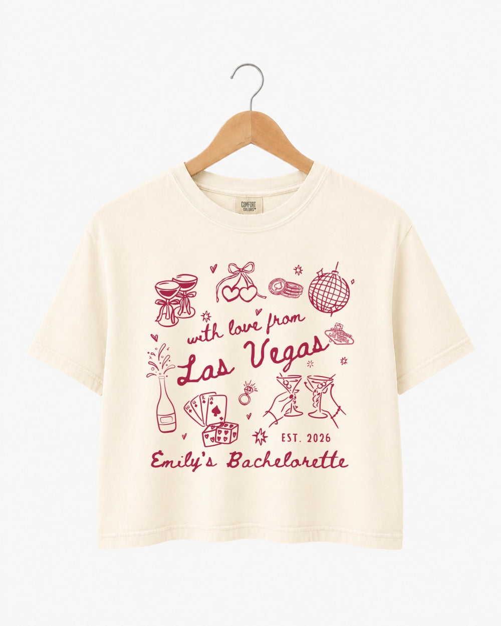 Las Vegas bachelorette weekend crop top with vintage line-art illustration and script lettering. Personalized with bride name, year, and destination city for the whole crew.