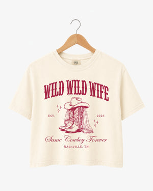 Bachelorette weekend crop top with vintage western art and cowgirl bride theme, Wild Wild Wife script. Personalized with bride name, year, and destination city for the Nashville or any-city bach crew.