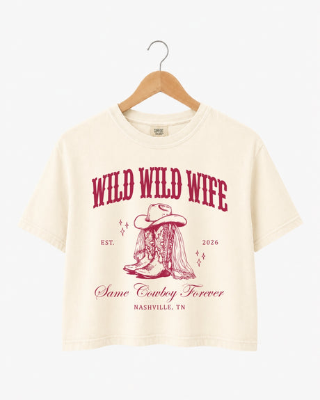 Bachelorette weekend crop top with vintage western art and cowgirl bride theme, Wild Wild Wife script. Personalized with bride name, year, and destination city for the Nashville or any-city bach crew.