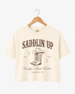 Bachelorette rodeo weekend crop top for the Last Rodeo bride and her crew. Vintage western style with bride name, year, and city customizable for any destination.