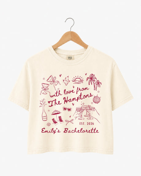 Bachelorette weekend crop top with playful illustrated doodles and script lettering. Personalized with bride name, year, and destination for the whole crew. Perfect for a Hamptons girls trip.