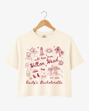 Bachelorette weekend crop top with playful line-art doodles and hand-drawn script, made for the bride and her crew. Personalize with bride name, destination, and EST year for the whole party.
