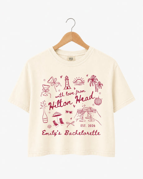 Bachelorette weekend crop top with playful line-art doodles and hand-drawn script, made for the bride and her crew. Personalize with bride name, destination, and EST year for the whole party.