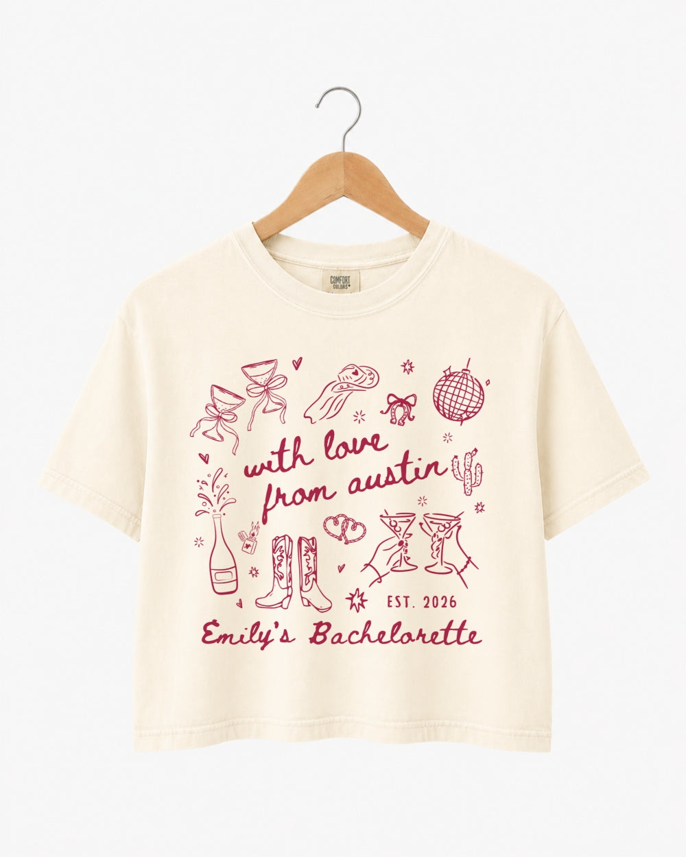 Bachelorette party crop top with minimalist line-art doodle script for an Austin weekend. Personalized with bride name, year, and city for the whole crew.