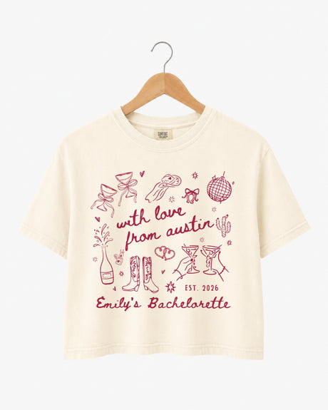 Bachelorette party crop top with minimalist line-art doodle script for an Austin weekend. Personalized with bride name, year, and city for the whole crew.