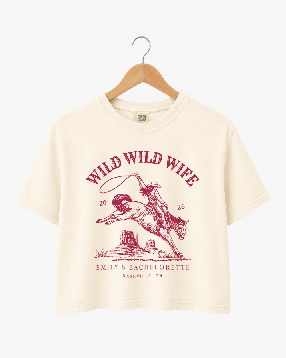 Bachelorette weekend crop top with vintage western rodeo art and Wild Wild Wife theme. Bride name, year, and destination city customizable for the whole Nashville-bound crew.