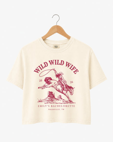 Bachelorette weekend crop top with vintage western rodeo art and Wild Wild Wife theme. Bride name, year, and destination city customizable for the whole Nashville-bound crew.