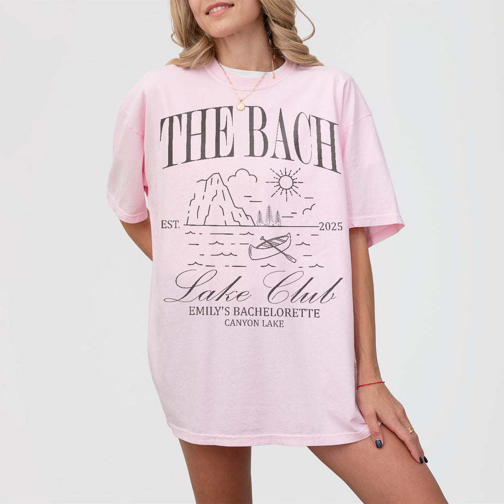 Soft pink custom bachelorette shirt perfect for outdoor adventures like hiking, kayaking, or camping with the bride tribe at a mountain lake cabin