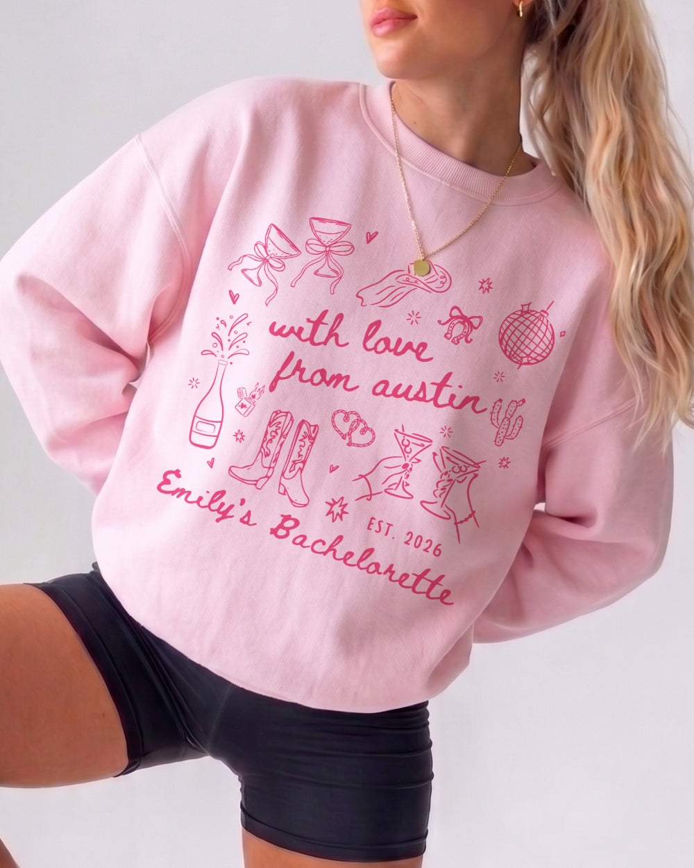 Personalized bachelorette sweatshirt with bride name, year, and Austin destination in soft doodle script lettering. Custom matching set for the whole bachelorette crew.