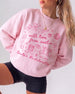 Personalized bachelorette sweatshirt with bride name, year, and Austin destination in soft doodle script lettering. Custom matching set for the whole bachelorette crew.