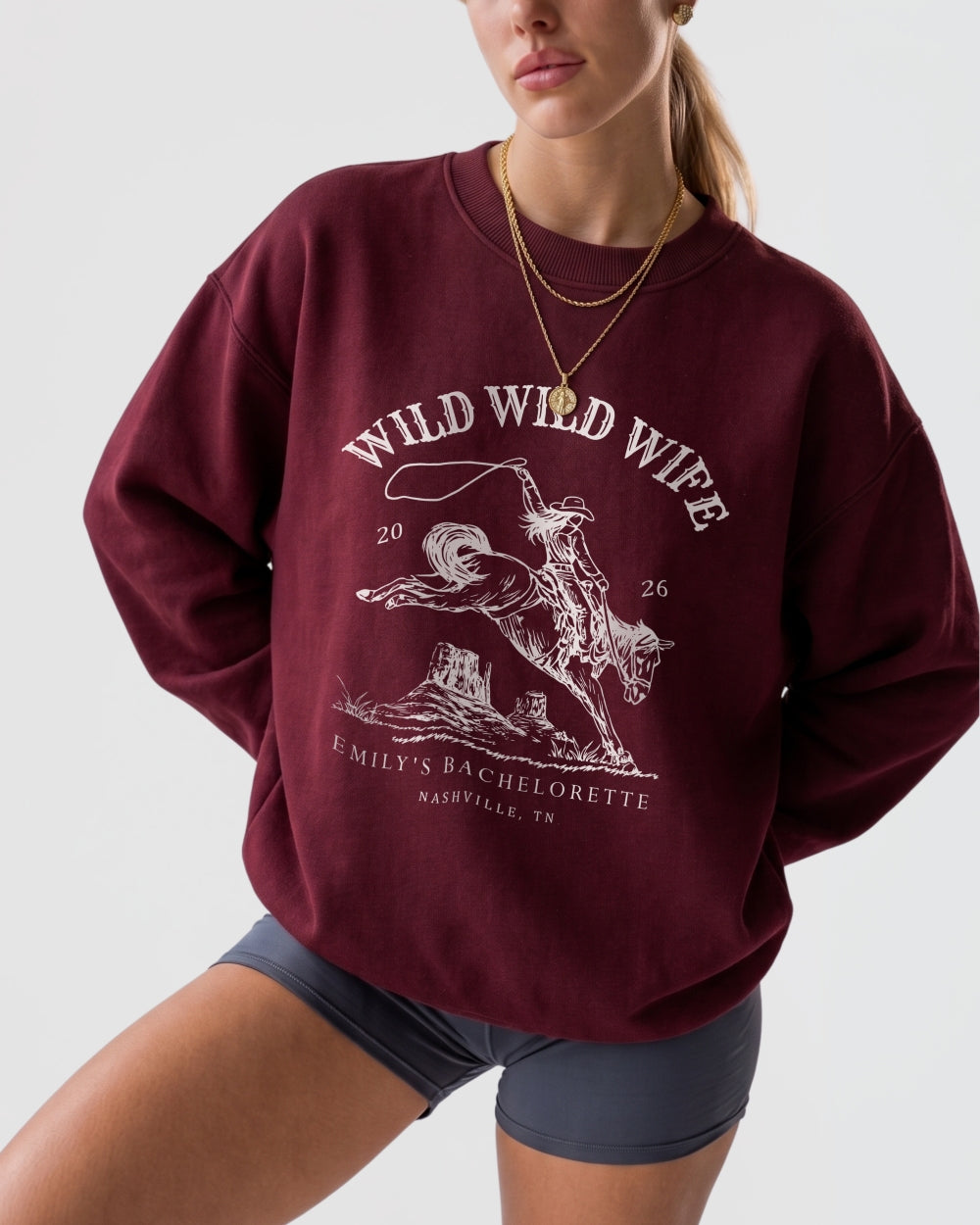 Bachelorette weekend sweatshirt with vintage western rodeo art and Wild Wild Wife theme. Personalized with bride name, date, and destination city for the whole Nashville-bound crew.