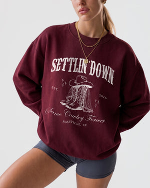 Bachelorette party sweatshirt for a western-themed Nashville weekend, vintage rodeo-style art with bride name, party year, and destination city customizable for the whole crew.