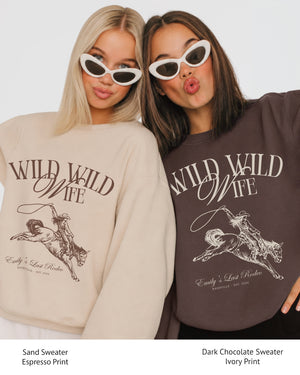 Personalized country western bachelorette sweatshirt with bride name, destination city, and EST year customizable. Wild Wild Wife rodeo theme with vintage western illustration and script typography.