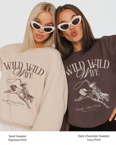 Personalized country western bachelorette sweatshirt with bride name, destination city, and EST year customizable. Wild Wild Wife rodeo theme with vintage western illustration and script typography.