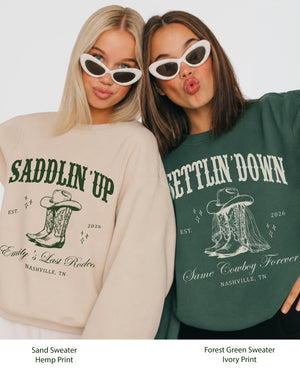 Gift idea for the bride squad: Saddlin' Up bachelorette sweatshirt with vintage western illustration. Personalized with bride name, party date, and destination city for the whole crew.