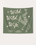 Gift idea for the bachelorette crew: Wild Wild Wife party banner with playful cowgirl and martini line art. Personalized with bride name, destination city, and wedding year.