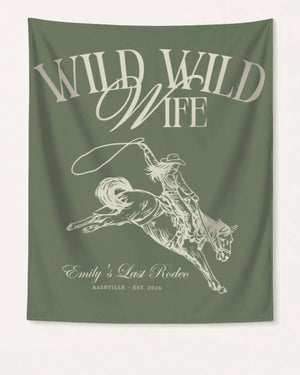 Bachelorette weekend banner with Wild Wild Wife cowgirl theme and vintage script lettering. Personalized with bride name, destination city, and year for the last rodeo crew.