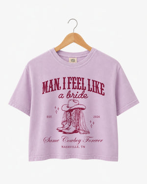 Bride and bridesmaids matching crop tops for a Nashville bachelorette rodeo weekend. Western script design with cowboy boot illustration, personalized with bride name, year, and destination city.