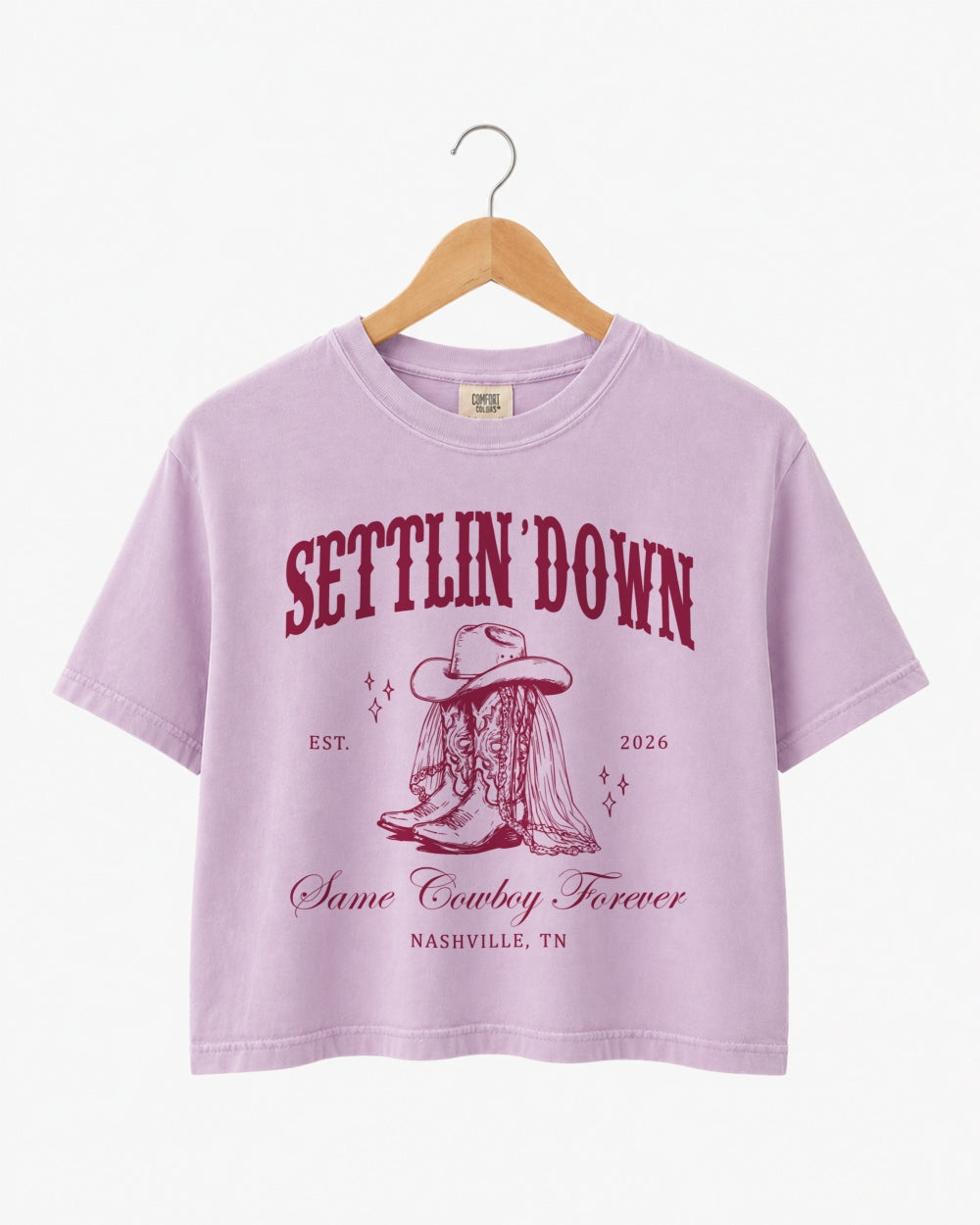 Bride and bridesmaids in matching rodeo bachelorette crop tops for a Last Rodeo western weekend. Personalized with bride name, year, and city for the full crew.