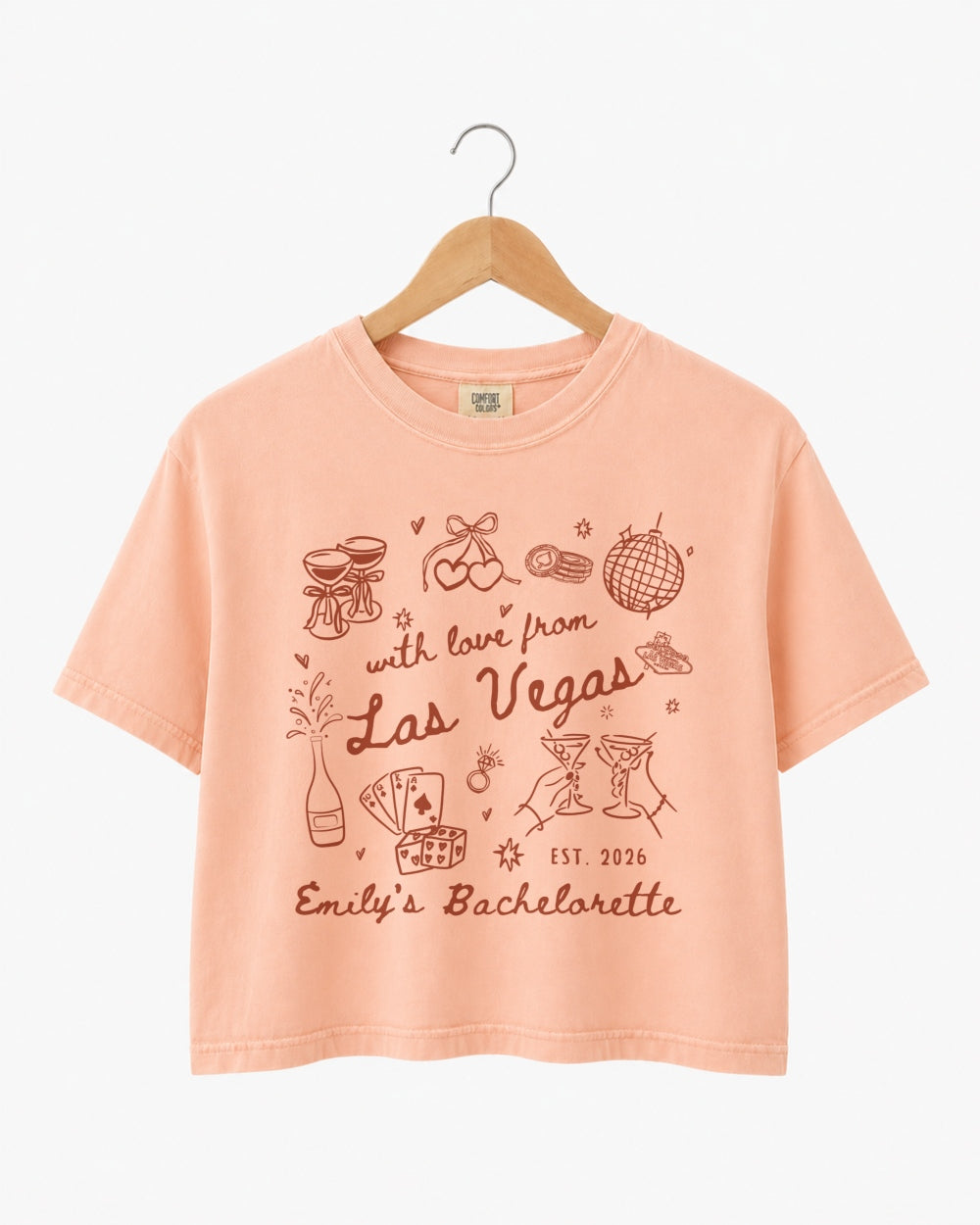 Vintage line-art bachelorette crop top with script lettering and Las Vegas theme. Personalized with bride name, year, and destination city for the whole crew.