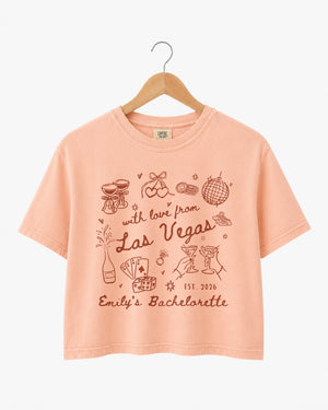 Vintage line-art bachelorette crop top with script lettering and Las Vegas theme. Personalized with bride name, year, and destination city for the whole crew.