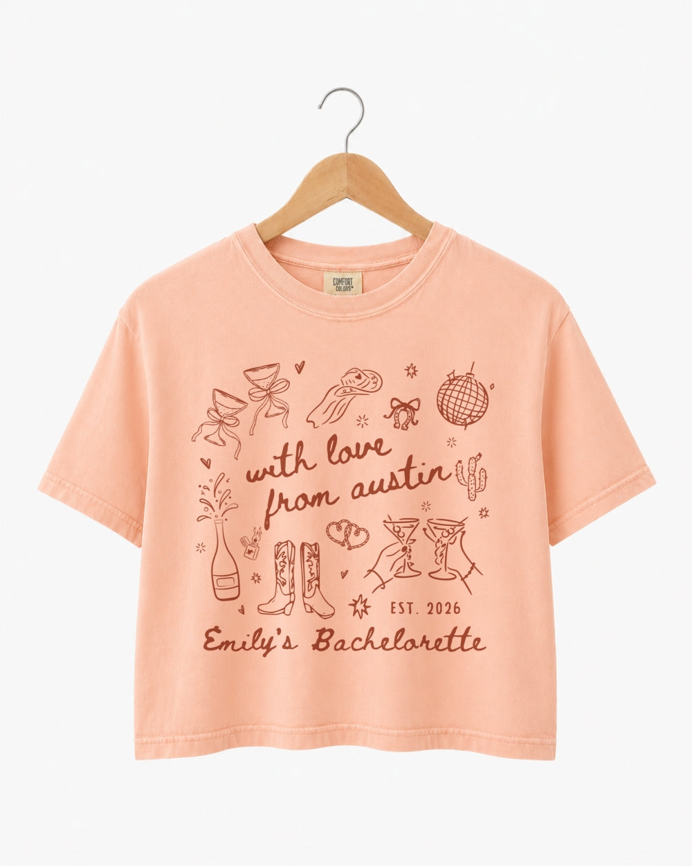 Minimalist doodle-script bachelorette crop top with hand-drawn Austin line art. Personalized with bride name, bachelorette year, and city for the whole crew.