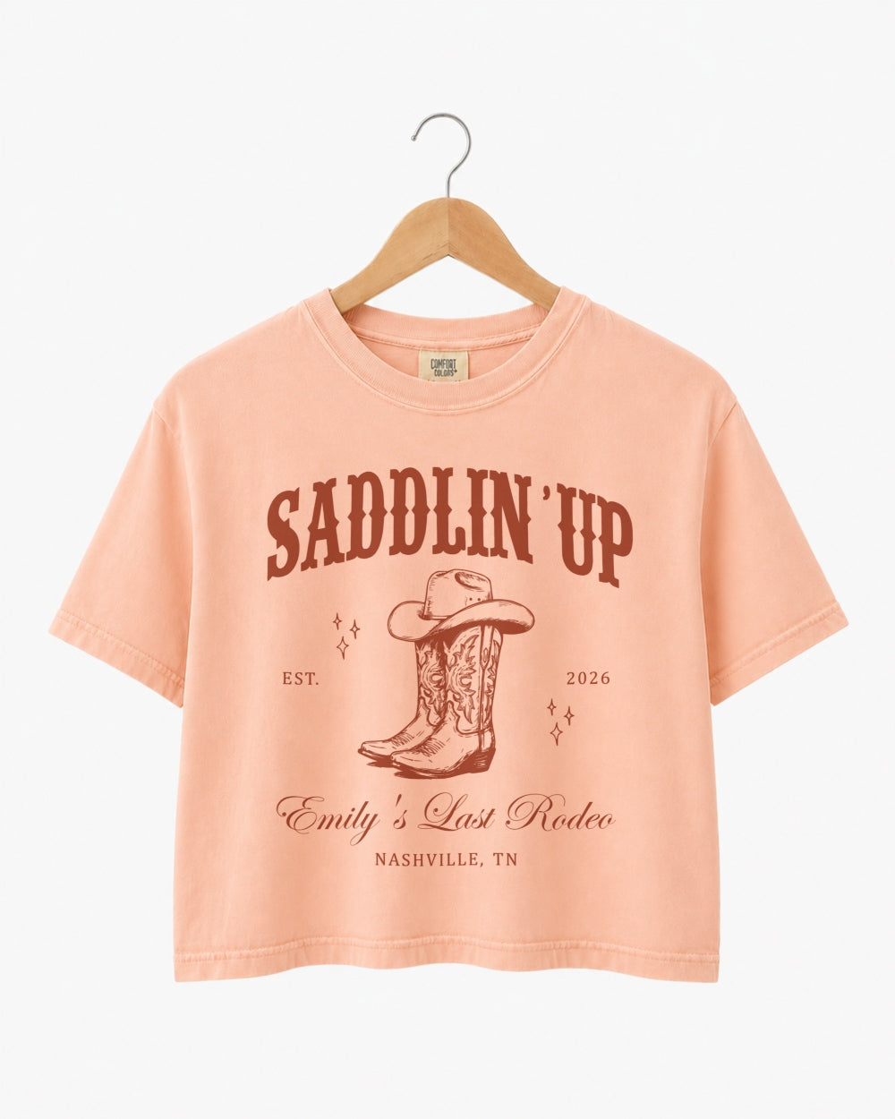 Vintage western bachelorette crop top with serif and script typography, rodeo-themed Last Rodeo design. Bride name, year, and city customizable for the full bachelorette crew.