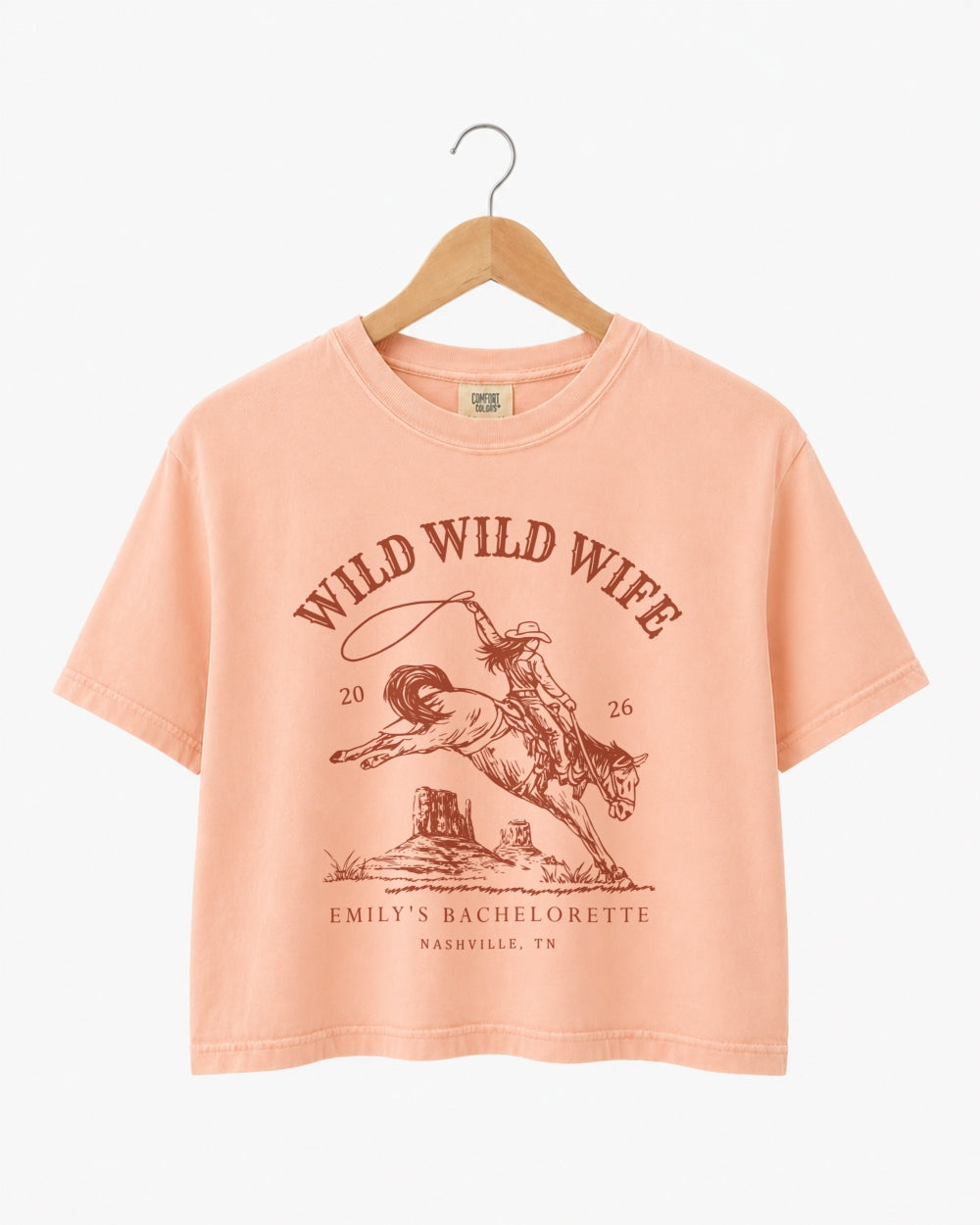 Vintage western bachelorette crop top with retro script and rodeo-style illustration art. Personalized with bride name, date, and city for the whole Nashville or destination bachelorette crew.