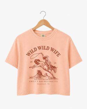 Vintage western bachelorette crop top with retro script and rodeo-style illustration art. Personalized with bride name, date, and city for the whole Nashville or destination bachelorette crew.
