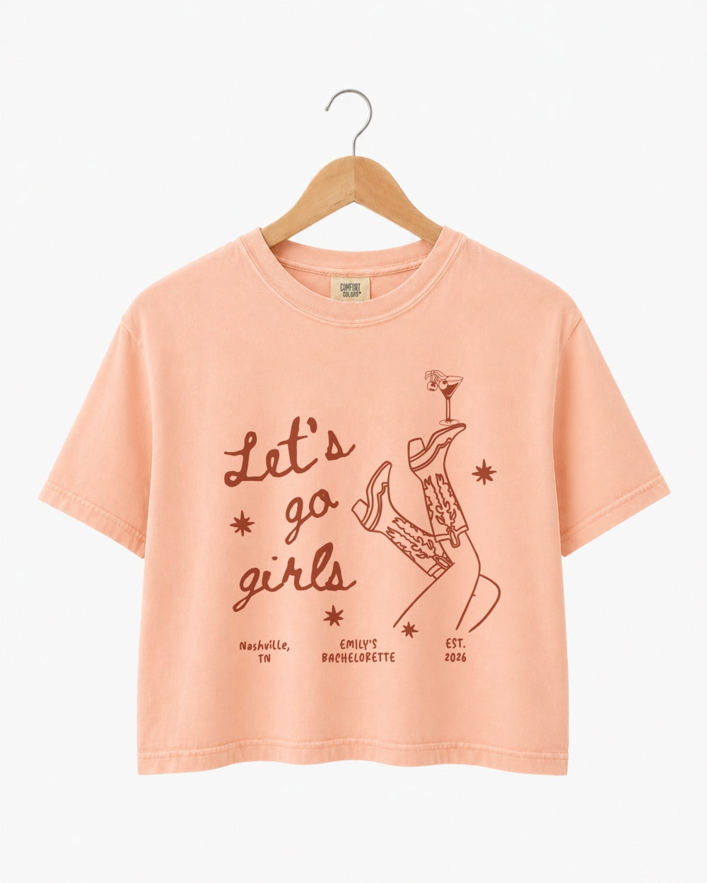 Vintage line-art crop top for girls night out, featuring script lettering with cowboy boots and martini glass illustrations. Boxy cropped fit made for the whole crew.
