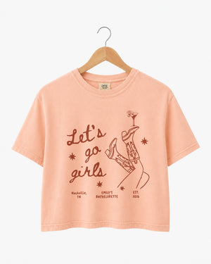 Vintage line-art crop top for girls night out, featuring script lettering with cowboy boots and martini glass illustrations. Boxy cropped fit made for the whole crew.