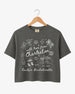 Cropped bachelorette top with hand-drawn doodle script and playful icons, Charleston weekend theme. Personalized with bride name, destination city, and EST year for the whole crew.