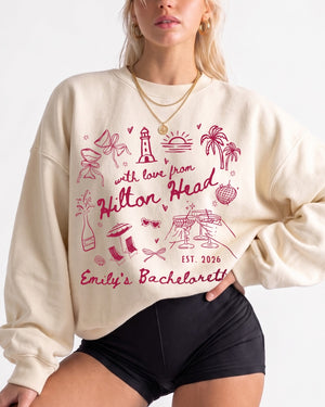 Personalized bachelorette sweatshirt with bride name, destination, and year on a whimsical doodle design. Custom matching set for the whole crew, perfect for a Hilton Head girls weekend.