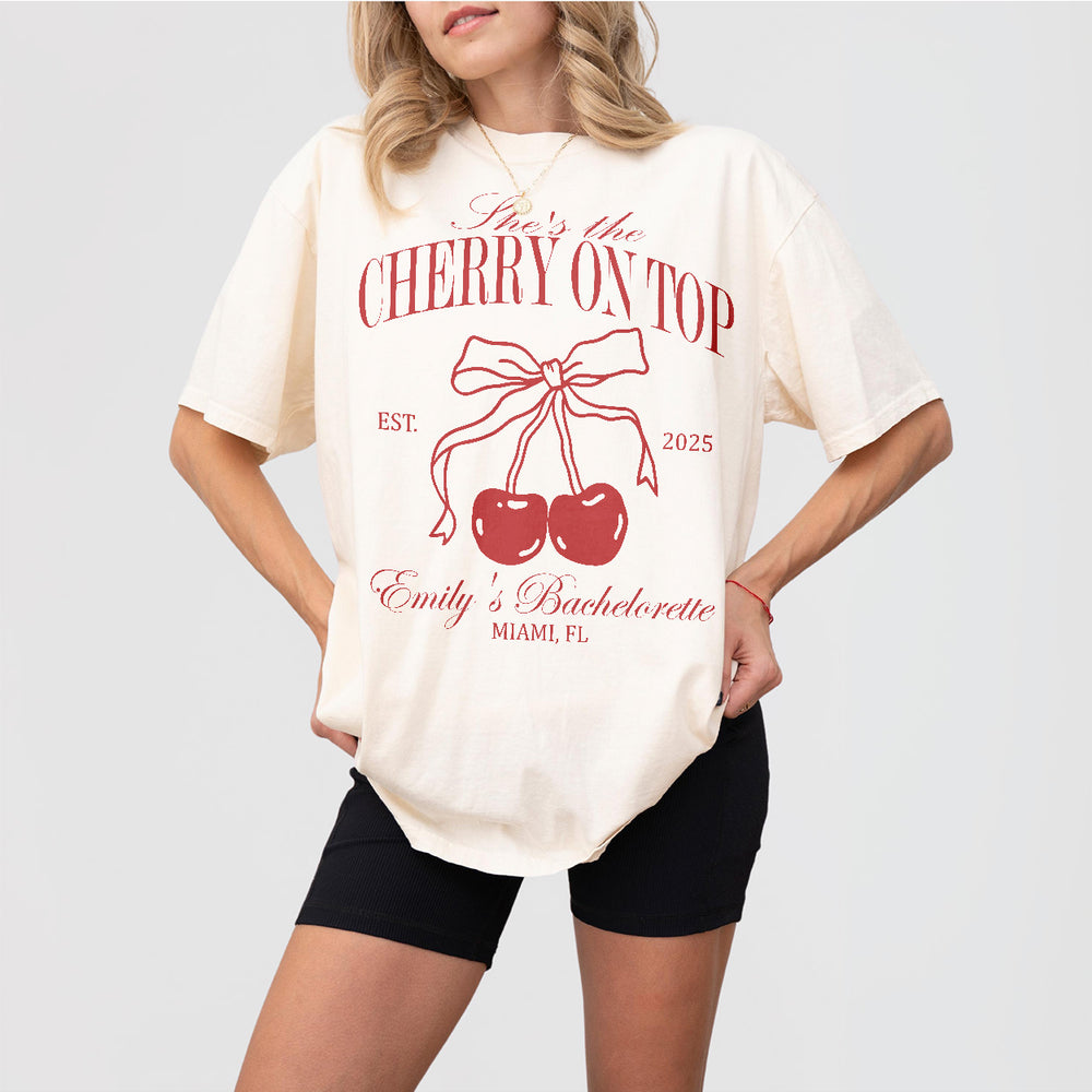 Ivory cotton bachelorette party shirt with a cherry print design - perfect for the bride to wear at her bridal shower or bachelorette celebration