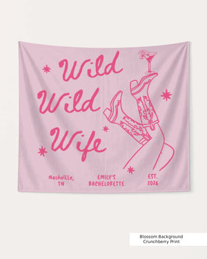 Gift idea for the bachelorette crew: Wild Wild Wife party banner with playful cowgirl and martini line art. Personalized with bride name, destination city, and weekend date.