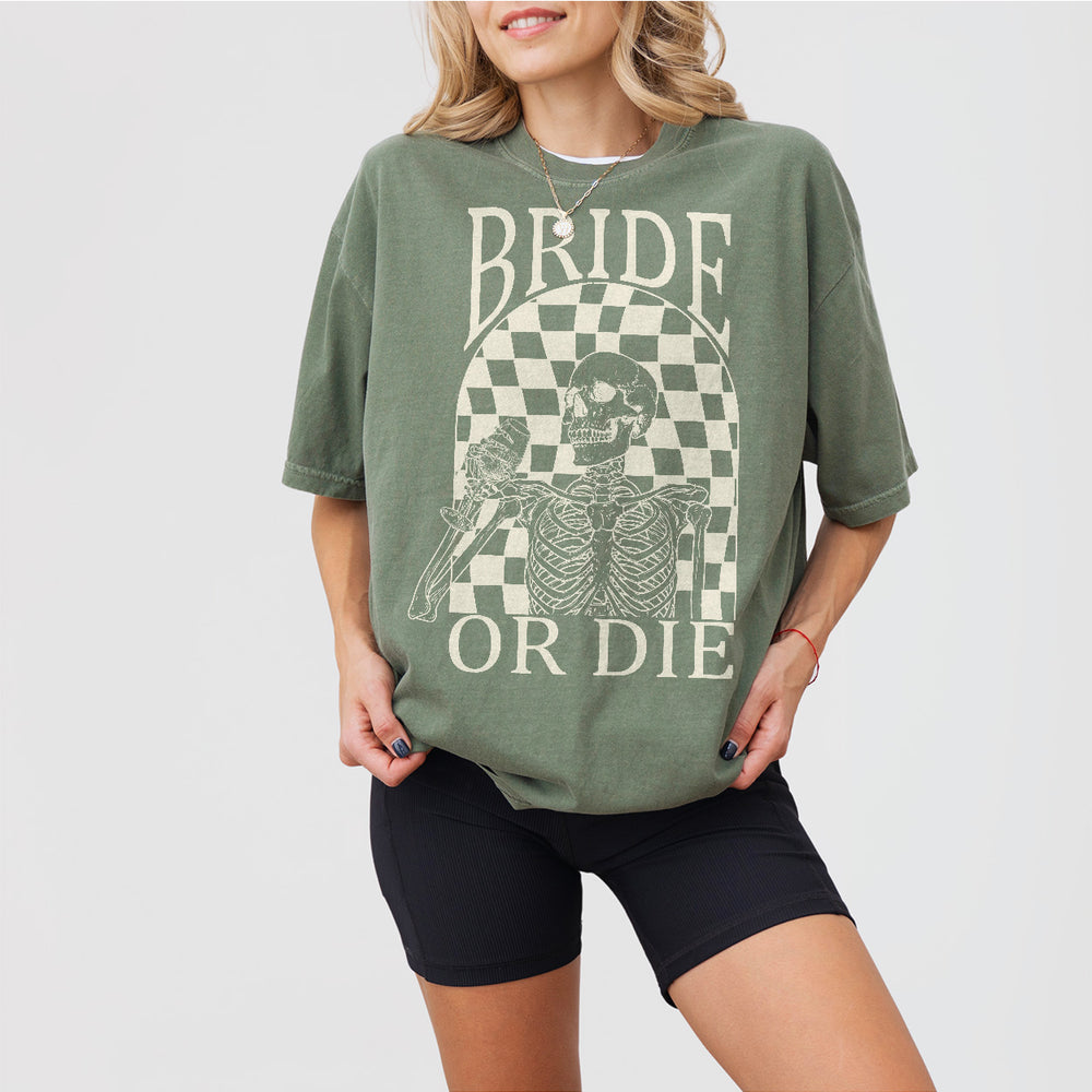 Cotton bachelorette party shirt in moss green with a playful 'Til Death Do Us Party' design featuring a witch hat - fun bridal shower or Halloween wedding favors