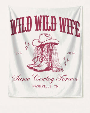 Gift idea for a cowgirl bachelorette party: Wild Wild Wife banner with vintage western illustration and script lettering. Customizable with bride name, year, and destination city.